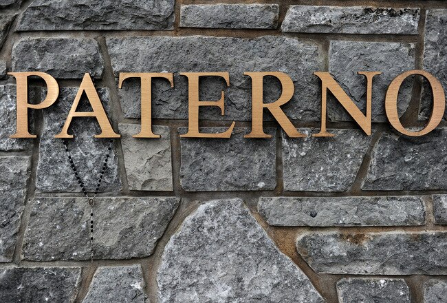 STATE COLLEGE, PA - JANUARY 22: A rosary necklace hangs from the name on the wall at the statue of Joe Paterno, the former Penn State football coach, outside of Beaver Stadium on January 22, 2012 in State College, Pennsylvania. Paterno, who was 85 years old, died due to complications from lung cancer. (Photo by Patrick Smith/Getty Images)