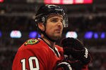 CHICAGO, IL - DECEMBER 30:  Patrick Sharp #10 of the Chicago Blackhawks rests during a break in the action against the Detroit Red Wings at the United Center on December 30, 2011 in Chicago, Illinois. The Blackhawks defeated the Red Wings 3-2.  (Photo by Jonathan Daniel/Getty Images)