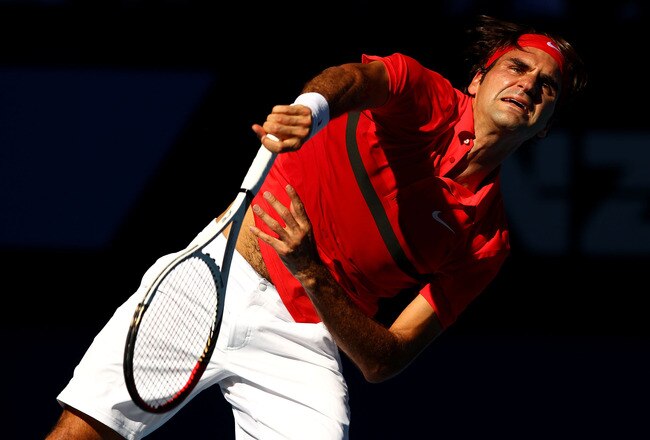 MELBOURNE, AUSTRALIA - JANUARY 24:  Roger Federer of Switzerland serves in his quarter final match against Juan Martin Del Potro of Argentina during day nine of the 2012 Australian Open at Melbourne Park on January 24, 2012 in Melbourne, Australia.  (Photo by Clive Brunskill/Getty Images)