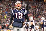 FOXBORO, MA - JANUARY 22:  Tom Brady #12 of the New England Patriots celebrates after scoring a touchdown in the fourth quarter against the Baltimore Ravens during their AFC Championship Game at Gillette Stadium on January 22, 2012 in Foxboro, Massachusetts.  (Photo by Jim Rogash/Getty Images)