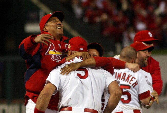 ST LOUIS, MO - OCTOBER 28:  Octavio Dotel #28 and Albert Pujols #5 of the St. Louis Cardinals celebrate after defeating the Texas Rangers 6-2 to win the World Series in Game Seven of the MLB World Series at Busch Stadium on October 28, 2011 in St Louis, Missouri.  (Photo by Michael Heiman/Getty Images)
