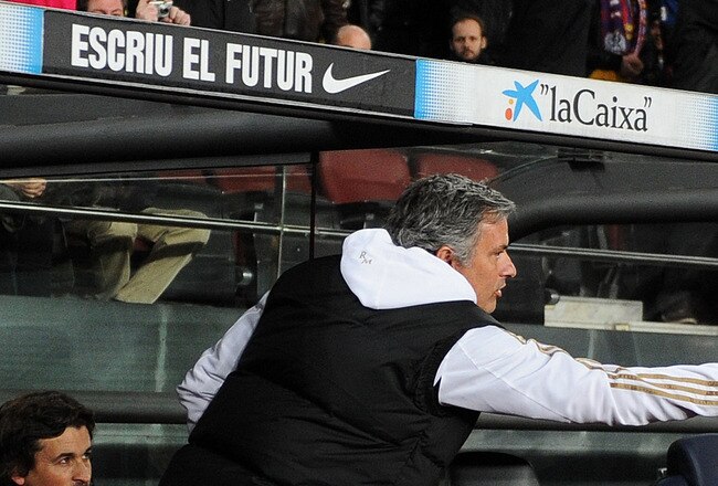 BARCELONA, SPAIN - JANUARY 25: Head coach Josep Guardiola (R) of FC Barcelona greets head coach Jose Mourinho of Real Madrid during the Copa del Rey quarter final second leg match between Barcelona and Real Madrid at Camp Nou stadium on January 25, 2012 in Barcelona, Spain.  (Photo by Jasper Juinen/Getty Images)