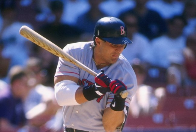 26 May 1996:  Outfielder Jose Canseco of the Boston Red Sox cringes as he pulls his left arm into his body after being struck by a pitch during an at-bat in the Red Sox 12-2 loss to the California Angels at Anaheim Stadium in Anaheim, California. Mandator