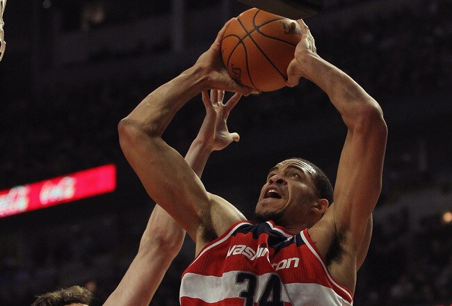 CHICAGO, IL - JANUARY 11:  JaVale McGee #34 of the Washington Wizards goes up for a shot against Omer Asik #3 of the Chicago Bulls at the United Center on January 11, 2012 in Chicago, Illinois. The Bulls defeated the Wizards 78-64. NOTE TO USER: User expressly acknowledges and agrees that, by downloading and or using this photograph, User is consenting to the terms and conditions of the Getty Images License Agreement.  (Photo by Jonathan Daniel/Getty Images)