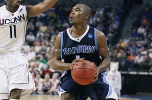 TAMPA, FL - MARCH 21: Brandon Johnson #1 of the San Diego Toreros brings the ball up court as he is guarded by Jermone Dyson #11 of the Connecticut Huskies during the first round of the 2008 NCAA Tournament West Regional at the St. Pete Times Forum on March 21, 2008 in Tampa, Florida. (Photo by Doug Benc/Getty Images)