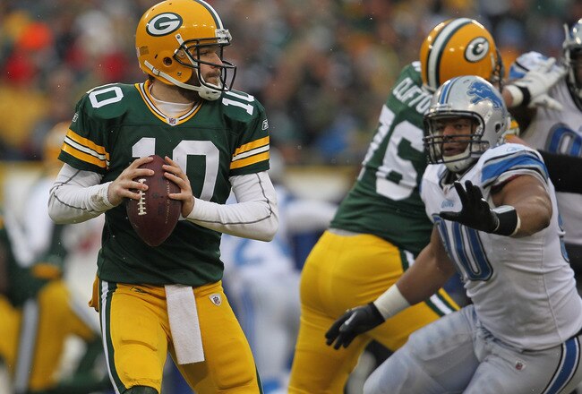 GREEN BAY, WI - JANUARY 01:  Matt Flynn #10 of the Green Bay Packerslooks for a receiver as Ndamukong Suh #90 of the Detroit Lions rushes at Lambeau Field on January 1, 2012 in Green Bay, Wisconsin. The Packers defeated the Lions 45-41.  (Photo by Jonathan Daniel/Getty Images)