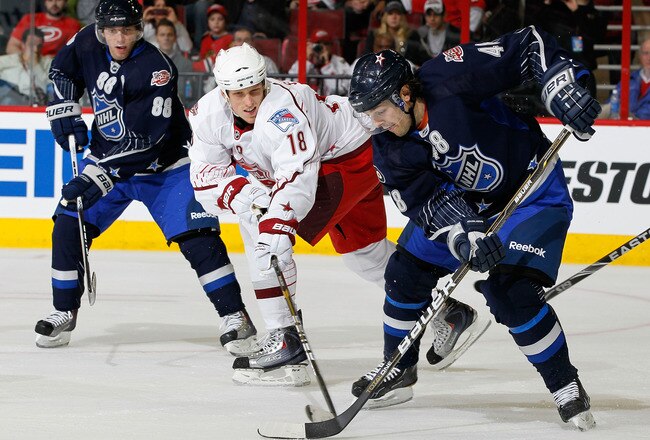 RALEIGH, NC - JANUARY 30:  Team Staal player Marc Staal #18 of the New York Rangers skates against Team Lidstrom player Danny Briere #48 of the Philadelphia Flyers against Team Staal Patrick Kane #88 of the Chicago Blackhawks looks on during the third period of the 58th NHL All-Star Game at RBC Center on January 30, 2011 in Raleigh, North Carolina.  (Photo by Kevin C. Cox/Getty Images)