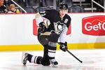 PITTSBURGH, PA - JANUARY 10:  Evgeni Malkin #71 of the Pittsburgh Penguins stretches before a game against the Ottawa Senators on January 10, 2012 at CONSOL Energy Center in Pittsburgh, Pennsylvania.  (Photo by Jamie Sabau/Getty Images)