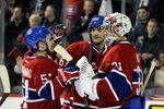 MONTREAL, CANADA - JANUARY 25:  Carey Price #31 of the Montreal Canadiens celebrates the victory over the Detroit Red Wings with teammates Max Pacioretty #67 and David Desharnais #51 during the NHL game at the Bell Centre on January 25, 2012 in Montreal, Quebec, Canada.  The Canadiens defeated the Red Wings 7-2.  (Photo by Richard Wolowicz/Getty Images)