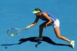 MELBOURNE, AUSTRALIA - JANUARY 26:  Victoria Azarenka of Belarus plays a forehand in her semifinal match against Kim Clijsters of Belgium during day eleven of the 2012 Australian Open at Melbourne Park on January 26, 2012 in Melbourne, Australia.  (Photo by Lucas Dawson/Getty Images)