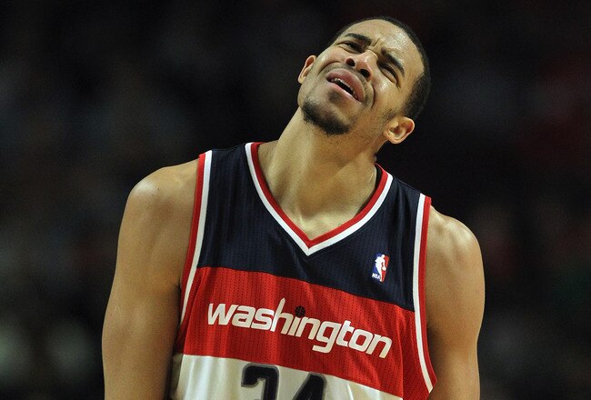 CHICAGO, IL - JANUARY 11:  JaVale McGee #34 of the Washington Wizards reacts after being called for a foul against the Chicago Bulls at the United Center on January 11, 2012 in Chicago, Illinois. The Bulls defeated the Wizards 78-64. NOTE TO USER: User expressly acknowledges and agrees that, by downloading and or using this photograph, User is consenting to the terms and conditions of the Getty Images License Agreement.  (Photo by Jonathan Daniel/Getty Images)