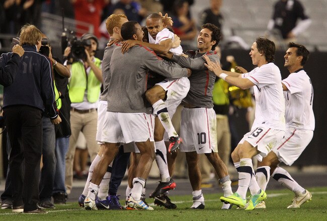 GLENDALE, AZ - JANUARY 21:  Ricardo Clark #15 (R) of USA celebrates with teammates after scoring against Venezuela during the final moments of the friendly match at University of Phoenix Stadium on January 21, 2012 in Glendale, Arizona. USA defeated Venezuela 1-0.  (Photo by Christian Petersen/Getty Images)