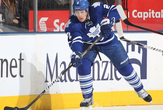TORONTO, CANADA - JANUARY 19:  Luke Schenn #2 of the Toronto Maple Leafs fires a pass in a game against the Minnesota Wild on January 19, 2012 at the Air Canada Centre in Toronto, Canada. The Leafs defeated the Wild 4-1. (Photo by Claus Andersen/Getty Images)