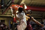 PHILADELPHIA, PA - DECEMBER 08:  Trevor Mbakwe #32 of the Minnesota Golden Gophers defends against Ronald Roberts Jr. #13 of the St. Joseph's Hawks at Michael J. Hagan Arena on December 8, 2010 in Philadelphia, Pennsylvania.  (Photo by Chris Chambers/Getty Images)