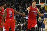 OAKLAND, CA - DECEMBER 25:  Blake Griffin #32 of the Los Angeles Clippers celebrates with Chris Paul #3 against Golden State Warriors during the season opener at Oracle Arena on December 25, 2011 in Oakland, California.  NOTE TO USER: User expressly acknowledges and agrees that, by downloading and or using this photograph, User is consenting to the terms and conditions of the Getty Images License Agreement.  (Photo by Jed Jacobsohn/Getty Images)