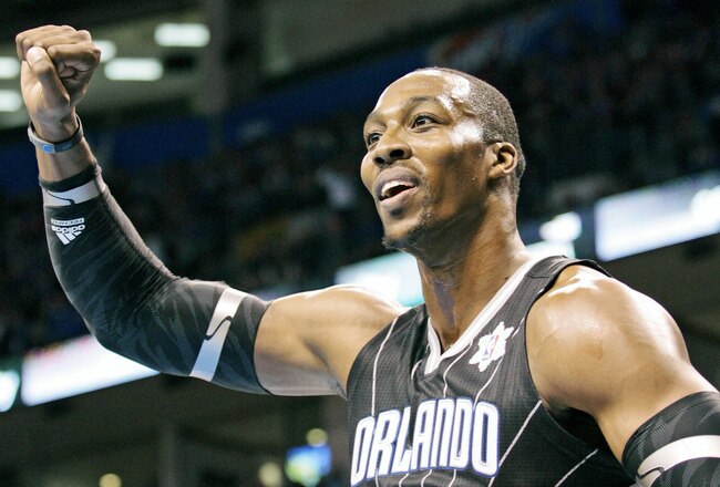 OKLAHOMA CITY, OK - DECEMBER 25:  Dwight Howard #12 of the Orlando Magic looks to have a foul called during the NBA season opening game against the Oklahoma City Thunder December 25, 2011 at the Chesapeake Energy Arena in Oklahoma City, Oklahoma.  Oklahoma City defeated Orlando 97-89. NOTE TO USER: User expressly acknowledges and agrees that, by downloading and or using this Photograph, user is consenting to the terms and conditions of the Getty Images License Agreement.  (Photo by Brett Deering/Getty Images)