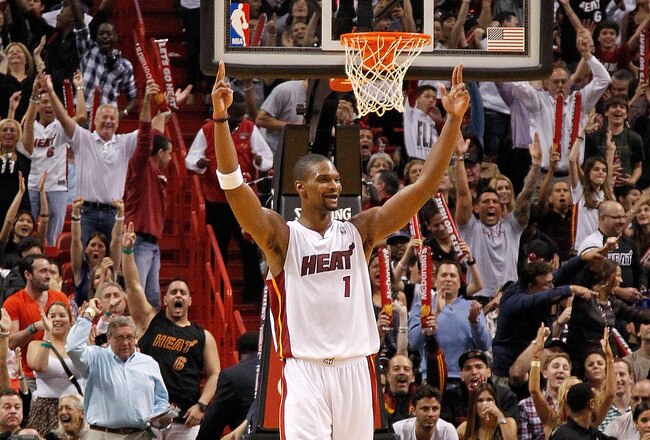 MIAMI, FL - JANUARY 17: Chris Bosh #1 of the Miami Heat reacts during a game against the San Antonio Spurs  at American Airlines Arena on January 17, 2012 in Miami, Florida. NOTE TO USER: User expressly acknowledges and agrees that, by downloading and/or using this Photograph, User is consenting to the terms and conditions of the Getty Images License Agreement.  (Photo by Mike Ehrmann/Getty Images)