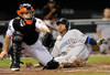 BALTIMORE, MD - AUGUST 31:  Yunel Escobar #5 of the Toronto Blue Jays slides into home plate ahead of the throw to catcher Craig Tatum #15 of the Baltimore Orioles in the third inning at Oriole Park at Camden Yards on August 31, 2011 in Baltimore, Maryland.  (Photo by Greg Fiume/Getty Images)