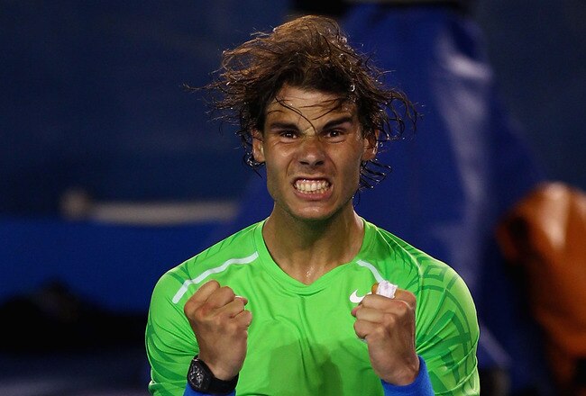 MELBOURNE, AUSTRALIA - JANUARY 26:  Rafael Nadal of Spain celebrates winning his semifinal match against Roger Federer of Switzerland during day eleven of the 2012 Australian Open at Melbourne Park on January 26, 2012 in Melbourne, Australia.  (Photo by Clive Brunskill/Getty Images)