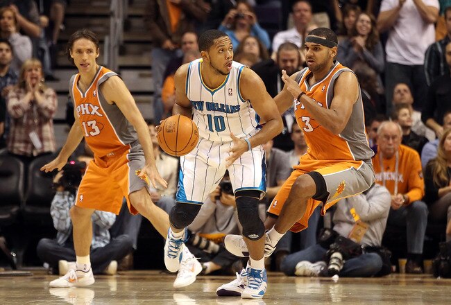 PHOENIX, AZ - DECEMBER 26:  Eric Gordon #10 of the New Orleans Hornets handles the ball during the season openning NBA game against the Phoenix Suns at US Airways Center on December 26, 2011 in Phoenix, Arizona.  The Hornets defeated the Suns 85-84. NOTE TO USER: User expressly acknowledges and agrees that, by downloading and or using this photograph, User is consenting to the terms and conditions of the Getty Images License Agreement.  (Photo by Christian Petersen/Getty Images)