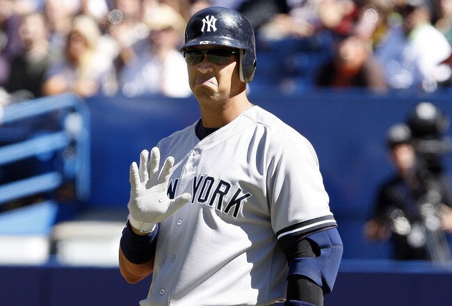 TORONTO, CANADA - SEPTEMBER 18: Alex Rodriguez #13 of the New York Yankees apologizes for losing grip with his bat and sending it into the seats during MLB action against the Toronto Blue Jays at the Rogers Centre September 18, 2011 in Toronto, Ontario, Canada. (Photo by Abelimages/Getty Images)