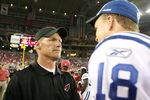 GLENDALE, AZ - SEPTEMBER 27:  Head coach Ken Whisenhunt of the Arizona Cardinals talks with quarterback Peyton Manning #18 of the Indianapolis Colts  after the Colts defeated the Cardinals 31-10 during the game at University of Phoenix Stadium on September 27, 2009 in Glendale, Arizona. (Photo by Christian Petersen/Getty Images)