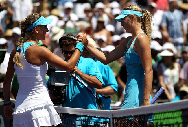 KEY BISCAYNE, FL - APRIL 02:  Victoria Azarenka of Belarus is congratulated by Maria Sharapova (R) of Russia after Azarenka won their women's singles championship at the Sony Ericsson Open at Crandon Park Tennis Center on April 2, 2011 in Key Biscayne, Florida.  (Photo by Clive Brunskill/Getty Images)