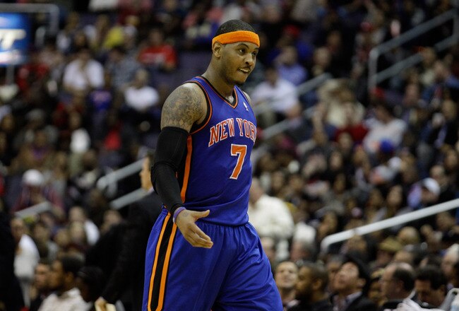 WASHINGTON, DC - JANUARY 06:  Carmelo Anthony #7 of the New York Knicks reacts after making a basket during the second half against the Washington Wizards at Verizon Center on January 6, 2012 in Washington, DC.  NOTE TO USER: User expressly acknowledges and agrees that, by downloading and or using this photograph, User is consenting to the terms and conditions of the Getty Images License Agreement.  (Photo by Rob Carr/Getty Images)