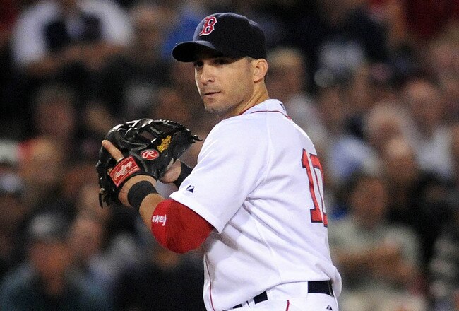 BOSTON, MA - SEPTEMBER 1: Marco Scutaro #10 of the Boston Red Sox throws to first base in the fifth inning against the New York Yankees at Fenway Park on September 1, 2011 in Boston, Massachusetts. The Yankees won the game 4-2. (Photo by Darren McCollester/Getty Images)
