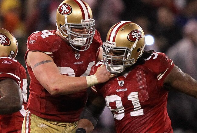 SAN FRANCISCO, CA - JANUARY 22:  Justin Smith #94 and Ray McDonald #91 of the San Francisco 49ers celebrate a defensive play in the second half against the New York Giants during the NFC Championship Game at Candlestick Park on January 22, 2012 in San Francisco, California.  (Photo by Jamie Squire/Getty Images)