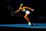 MELBOURNE, AUSTRALIA - JANUARY 26:  Maria Sharapova of Russia plays a forehand in her semifinal match against Petra Kvitova of the Czech Republic during day eleven of the 2012 Australian Open at Melbourne Park on January 26, 2012 in Melbourne, Australia.  (Photo by Clive Brunskill/Getty Images)