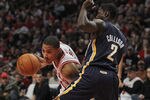 CHICAGO, IL - DECEMBER 20:  Derrick Rose #1 of the Chicago Bulls drives around Darren Collison #2 of the Indiana Pacers at the United Center on December 20, 2011 in Chicago, Illinois. The Bulls defeated the Pacers 93-85. NOTE TO USER: User expressly acknowledges and agrees that, by downloading and or using this photograph, User is consenting to the terms and conditions of the Getty Images License Agreement.  (Photo by Jonathan Daniel/Getty Images)