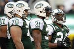EAST RUTHERFORD, NJ - DECEMBER 24: Darrelle Revis #24 of the New York Jets looks up at the score board as he stands next to teammates Calvin Pace #97, Mike DeVito #70 and Antonio Cromartie #31during a game against the New York Giants at MetLife Stadium on December 24, 2011 in East Rutherford. New Jersey. The Giants won 29 - 14. (Photo by Rich Schultz/Getty Images)