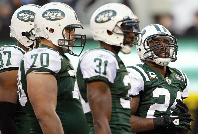 EAST RUTHERFORD, NJ - DECEMBER 24: Darrelle Revis #24 of the New York Jets looks up at the score board as he stands next to teammates Calvin Pace #97, Mike DeVito #70 and Antonio Cromartie #31during a game against the New York Giants at MetLife Stadium on December 24, 2011 in East Rutherford. New Jersey. The Giants won 29 - 14. (Photo by Rich Schultz/Getty Images)