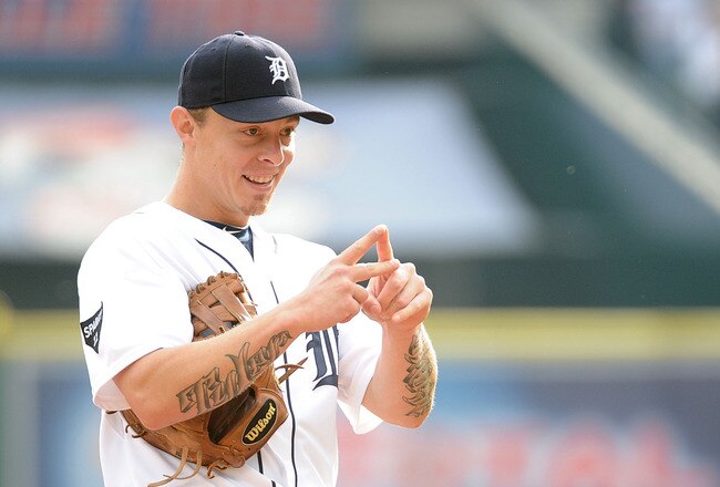 DETROIT, MI - OCTOBER 12:  Brandon Inge #15 of the Detroit Tigers signals prior to Game Four of the American League Championship Series against the Texas Rangers at Comerica Park on October 12, 2011 in Detroit, Michigan.  (Photo by Harry How/Getty Images)