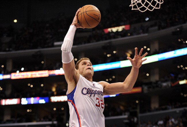LOS ANGELES, CA - JANUARY 14:  Blake Griffin #32 of the Los Angeles Clippers goes in for a dunk in front of Metta World Peace #15 of the Los Angeles Lakers at Staples Center on January 14, 2012 in Los Angeles, California.  The Clippers won 102-94.  NOTE TO USER: User expressly acknowledges and agrees that, by downloading and/or using this Photograph, user is consenting to the terms and conditions of the Getty Images License Agreement.  (Photo by Harry How/Getty Images)
