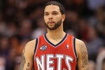 PHOENIX, AZ - JANUARY 13:  Deron Williams #8 of the New Jersey Nets in action during the NBA game against the Phoenix Suns at US Airways Center on January 13, 2012 in Phoenix, Arizona. The Nets defeated the Suns 110-103.   NOTE TO USER: User expressly acknowledges and agrees that, by downloading and or using this photograph, User is consenting to the terms and conditions of the Getty Images License Agreement.  (Photo by Christian Petersen/Getty Images)