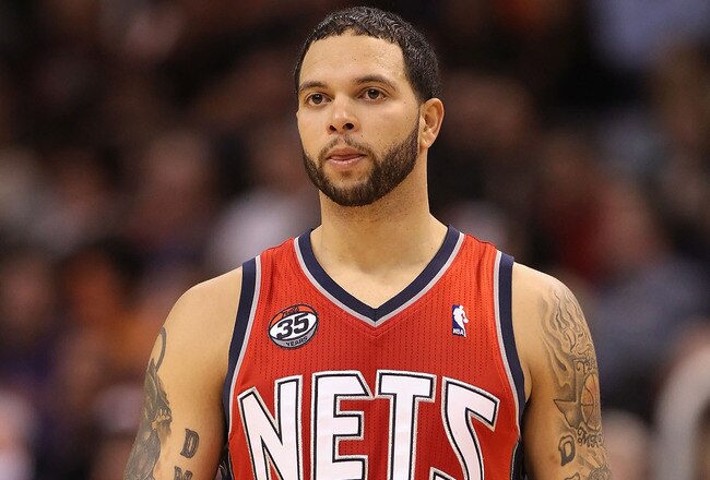 PHOENIX, AZ - JANUARY 13:  Deron Williams #8 of the New Jersey Nets in action during the NBA game against the Phoenix Suns at US Airways Center on January 13, 2012 in Phoenix, Arizona. The Nets defeated the Suns 110-103.   NOTE TO USER: User expressly acknowledges and agrees that, by downloading and or using this photograph, User is consenting to the terms and conditions of the Getty Images License Agreement.  (Photo by Christian Petersen/Getty Images)