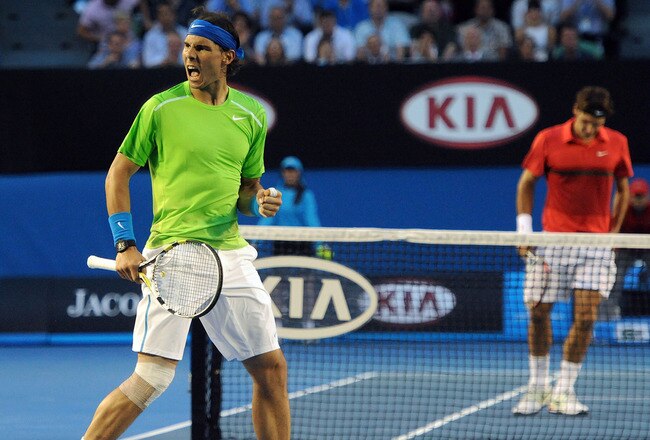 MELBOURNE, VICTORIA - JANUARY 26:  Rafael Nadal of Spain celebrates winning a point in his semifinal match against Roger Federer of Switzerland during day eleven of the 2012 Australian Open at Melbourne Park on January 26, 2012 in Melbourne, Australia.  (Photo by Joe Castro- Pool/Getty Images)