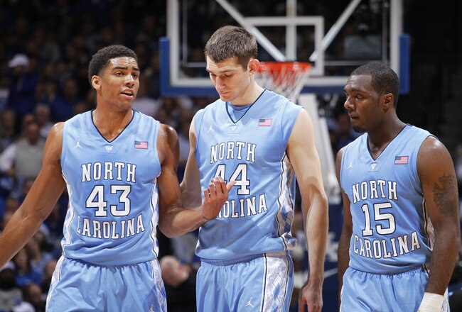 LEXINGTON, KY - DECEMBER 3: James Michael McAdoo #43, Tyler Zeller #44 and P.J. Hairston #15 of the North Carolina Tar Heels talk over strategy during the game against the Kentucky Wildcats at Rupp Arena on December 3, 2011 in Lexington, Kentucky. Kentucky won 73-72. (Photo by Joe Robbins/Getty Images)