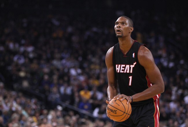 OAKLAND, CA - JANUARY 10:  Chris Bosh #1 of the Miami Heat in action against the Golden State Warriors at Oracle Arena on January 10, 2012 in Oakland, California.  NOTE TO USER: User expressly acknowledges and agrees that, by downloading and or using this photograph, User is consenting to the terms and conditions of the Getty Images License Agreement.  (Photo by Ezra Shaw/Getty Images)