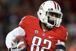 TUCSON, AZ - OCTOBER 23:  Wide receiver Juron Criner #82 of the Arizona Wildcats runs with the ball during the college football game against the Washington Huskies at Arizona Stadium on October 23, 2010 in Tucson, Arizona.   The Wildcats defeated the Huskies 44-14.  (Photo by Christian Petersen/Getty Images)
