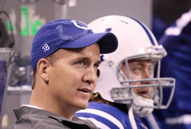 INDIANAPOLIS, IN - NOVEMBER 27:  Peyton Manning and Curtis Painter #7 of the Indianapolis Colts sit on the bench in the final minute of the game against the Carolina Panthers at Lucas Oil Stadium on November 27, 2011 in Indianapolis, Indiana.  The colts lost 27-19. (Photo by Andy Lyons/Getty Images)