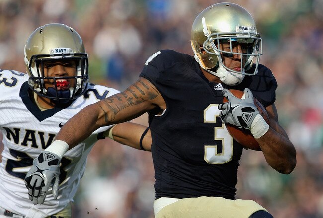 SOUTH BEND, IN - OCTOBER 29: Michael Floyd #3 of the Notre Dame Fighting Irish runs in front of Chris Ferguson #23 of the Navy Midshipmen on a 56 yard touchdown catch at Notre Dame Stadium on October 29, 2011 in South Bend, Indiana. (Photo by Jonathan Daniel/Getty Images)
