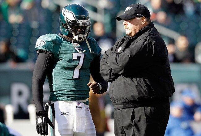 PHILADELPHIA, PA - JANUARY 01:  Michael Vick #7 of the Philadelphia Eagles talks with head coach Andy Reid before the start of the Eagles game against the Washington Redskins at Lincoln Financial Field on January 1, 2012 in Philadelphia, Pennsylvania.  (Photo by Rob Carr/Getty Images)
