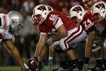 MADISON, WI - OCTOBER 16: Peter Konz #66 of the Wisconsin Badgers prepares to snap the ball to Scott Tolzien #16 against the Ohio State Buckeyes at Camp Randall Stadium on October 16, 2010 in Madison, Wisconsin. Wisconsin defeated Ohio State 31-18.  (Photo by Jonathan Daniel/Getty Images)