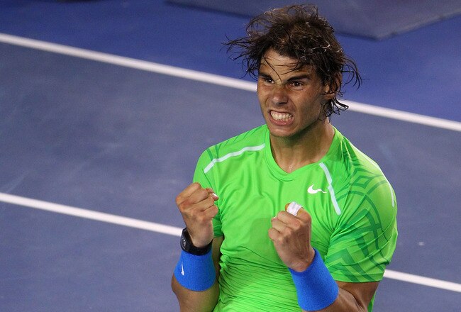 MELBOURNE, AUSTRALIA - JANUARY 26:  Rafael Nadal of Spain celebrates winning his semifinal match against Roger Federer of Switzerland during day eleven of the 2012 Australian Open at Melbourne Park on January 26, 2012 in Melbourne, Australia.  (Photo by Scott Barbour/Getty Images)