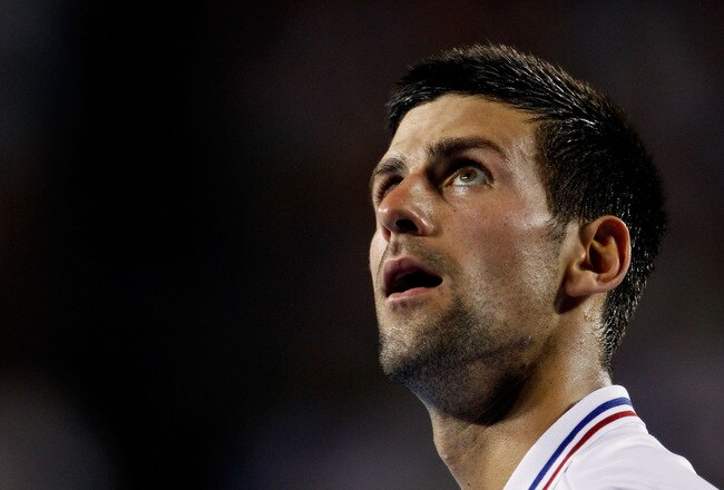 MELBOURNE, AUSTRALIA - JANUARY 27:  Novak Djokovic of Serbia watches on in his semifinal match against Andy Murray of Great Britain during day twelve of the 2012 Australian Open at Melbourne Park on January 27, 2012 in Melbourne, Australia.  (Photo by Aaron Favila-Pool/Getty Images)