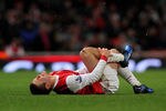 LONDON, ENGLAND - NOVEMBER 30:  Jack Wilshere of Arsenal lies on the ground during the Carling Cup quarter final match between Arsenal and Wigan Athletic at the Emirates Stadium on November 30, 2010 in London, England.  (Photo by Clive Rose/Getty Images)