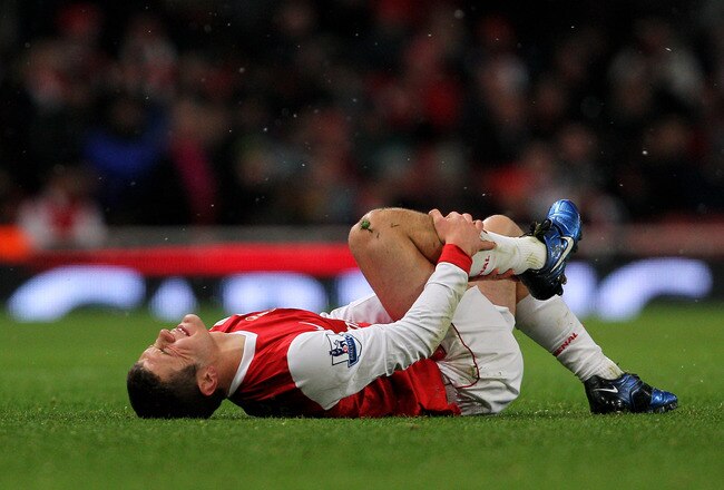 LONDON, ENGLAND - NOVEMBER 30:  Jack Wilshere of Arsenal lies on the ground during the Carling Cup quarter final match between Arsenal and Wigan Athletic at the Emirates Stadium on November 30, 2010 in London, England.  (Photo by Clive Rose/Getty Images)